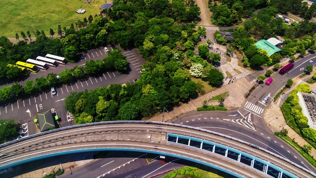 Aerial view time-lapse of traffic and the monorail  line in Odaiba, Tokyo, Japan.