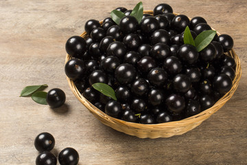 Berry Jaboticaba in bowl on wooden table