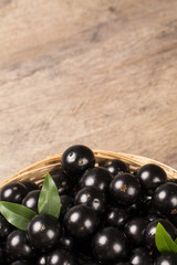 Berry Jaboticaba in bowl on wooden table