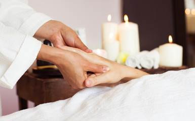 Close-up. Woman receiving a hand massage at the health spa.
