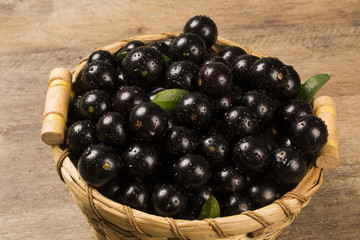 Berry Jaboticaba in bowl on wooden table