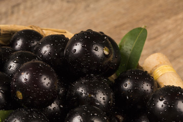 Berry Jaboticaba in bowl on wooden table
