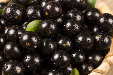 Berry Jaboticaba in bowl on wooden table