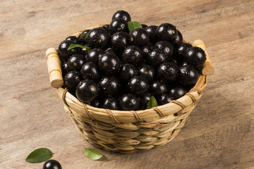 Berry Jaboticaba in bowl on wooden table