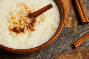 Rice pudding on beautiful wooden background, selective focus