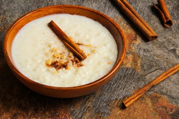 Rice pudding on beautiful wooden background, selective focus