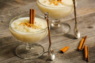 Rice pudding on beautiful wooden background, selective focus