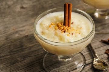 Rice pudding on beautiful wooden background, selective focus