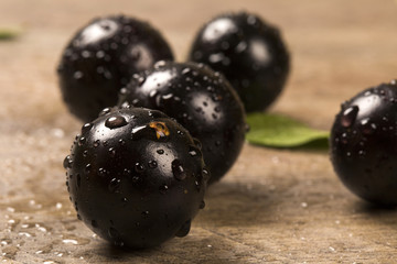 Berry Jaboticaba in bowl on wooden table