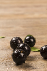 Berry Jaboticaba in bowl on wooden table