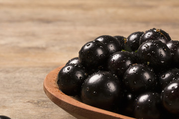 Berry Jaboticaba in bowl on wooden table