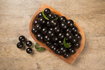 Berry Jaboticaba in bowl on wooden table