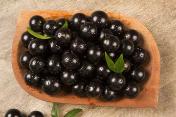 Berry Jaboticaba in bowl on wooden table