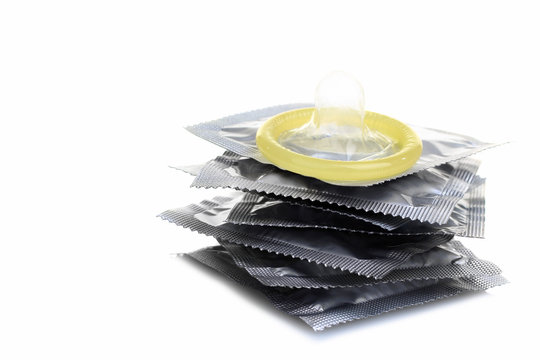 yellow condom on the sealed condoms