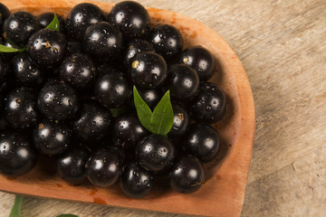 Berry Jaboticaba in bowl on wooden table