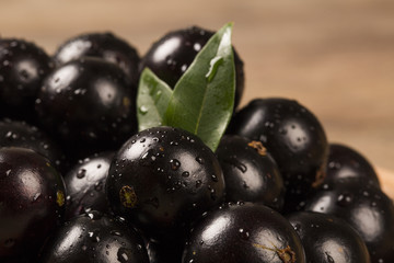 Berry Jaboticaba in bowl on wooden table