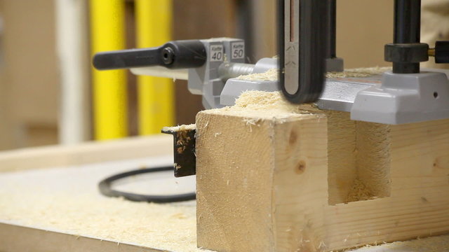 Router machine used on wooden plank  in carpenter workshop
