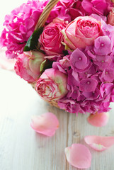 beautiful pink roses and hydrangea in basket