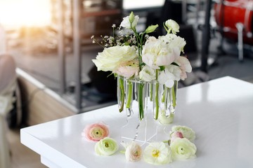 Wedding table decoration. Ranunculus flowers in vase
