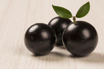 Berry Jaboticaba in bowl on white background