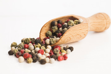 Mixed green, red, white and black peppercorns