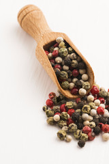 Mixed green, red, white and black peppercorns
