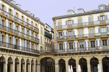 Fototapeta na wymiar Plaza de la Constitucion with balconies numbered from when used to view bull fights.San Sebastian,Spain