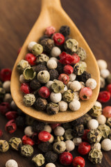 Mixed green, red, white and black peppercorns