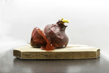 Red onions on a wooden cutboard