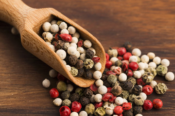 Mixed green, red, white and black peppercorns