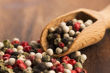 Mixed green, red, white and black peppercorns