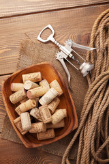 Bowl with wine corks and corkscrew