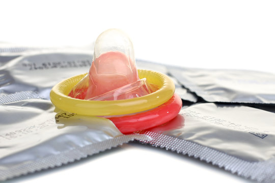 two open condoms  and sealed condoms