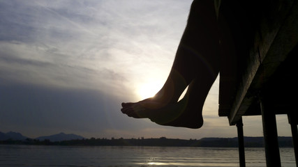 Man at a dock in the evening