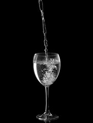 sparkling water filled in a wine glass