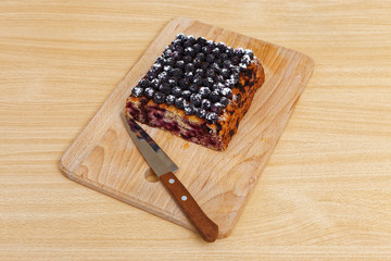 Part of cake with black raspberries