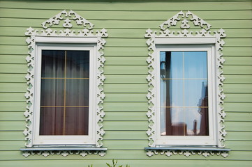 windows of the wooden houses are decorated with wood carvings