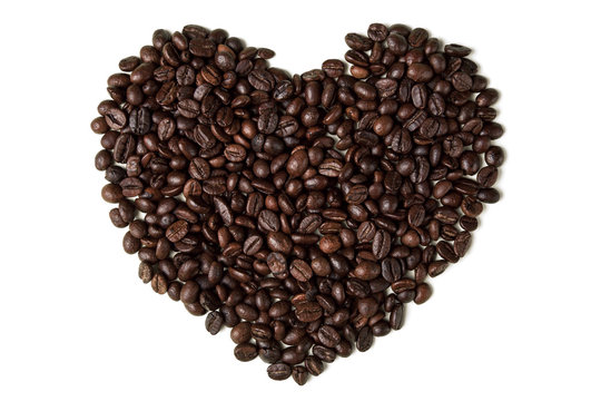 Heart from coffee beans. Isolated on white background.