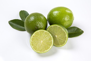 Fresh citrus lime with mint close up on wooden background