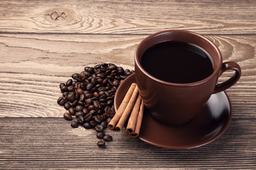 Cup of fresh espresso on wooden table