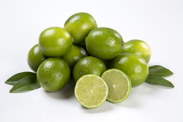 Naklejka na ściany i meble Fresh citrus lime with mint close up on wooden background