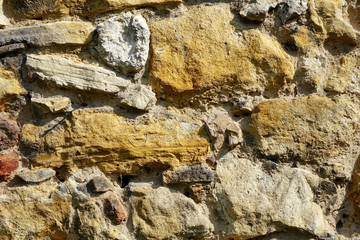 old yellow stoned brick wall