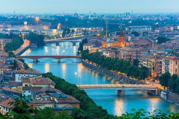 River Adige and bridges in Verona at night, Italy