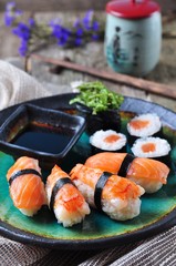 homemade sushi with wild salmon, shrimp, cucumber and seaweed. selective focus