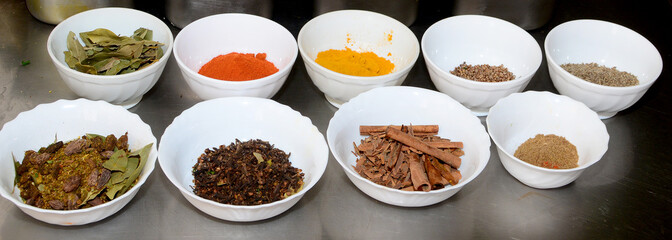 Food condiments in round dishes.