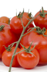 Tomatoes, closeup photo on a plate.