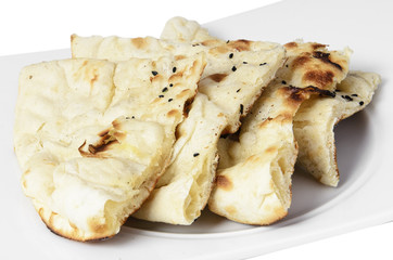 Bread with cumin on a plate with a with background.