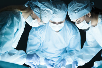 Medical team performing operation