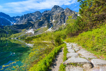 Path along beautiful green water Morskie Oko lake, Tatra Mountains, Poland