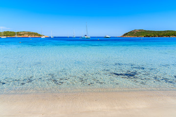 Fototapeta na wymiar Crystal clear sea water of Santa Giulia beach, Corsica island, France